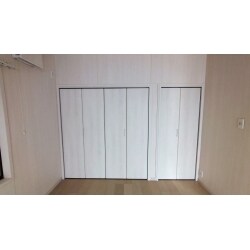 白い木目調のドアをお取り付けしました。