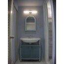 浴室の扉に光を通す半透明素材を採用。明るい洗面室になりました。
