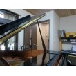 グランドピアノ越しに見た録音室です。ピアノを弾きながら防音ドアのスリット越しに音合わせをします。