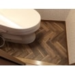 タイル張りの和式トイレだったので、床をおしゃれな木目調のクッションフロアにしました。