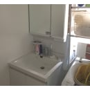 以前は手洗いと洗濯機しかなかった洗面脱衣室。今回のリフォームで　床・壁・天井と洗面化粧台を新設しました。