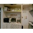 L字のキッチンの他に調理家電を置くカウンターがありましたが、L字型からI型に変えてできたスペースに造作棚を造りスッキリとした使い易いキッチン空間になりました。