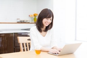 young asian woman using laptop