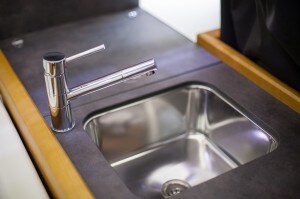 Close-up of a tap at a kitchen counter in a yacht