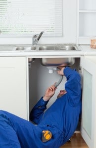 Portrait of a repairman fixing a sink