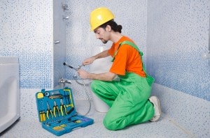 Plumber working in the bathroom